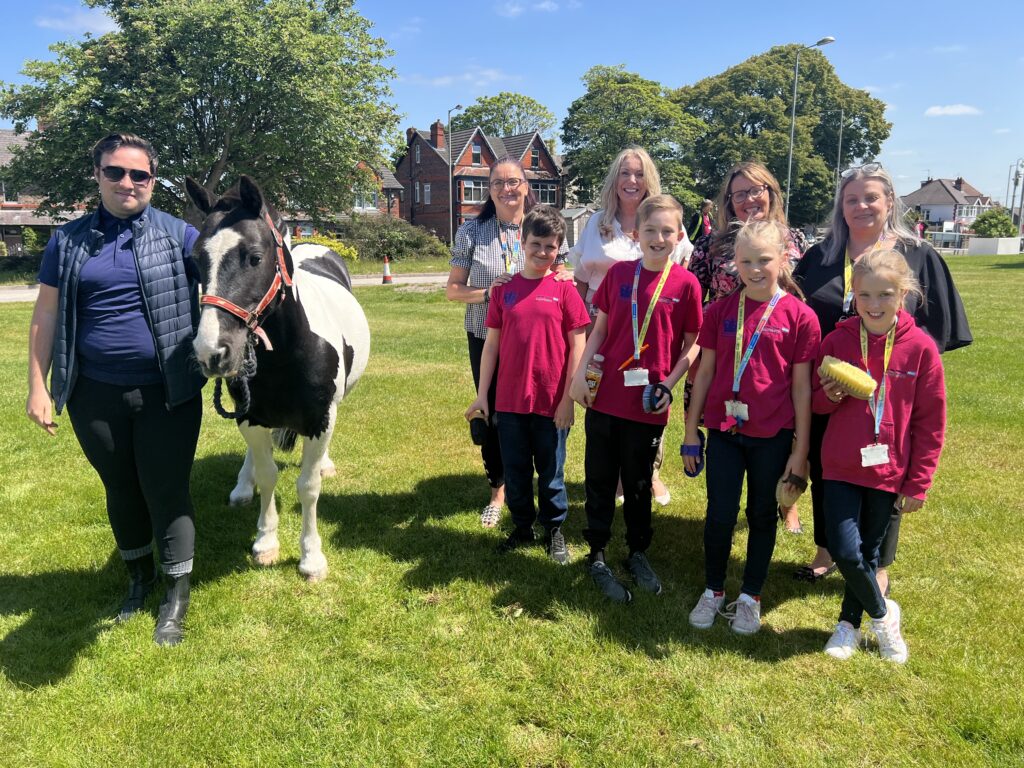 Photo of Young people meeting park palace ponies at Alder Hey