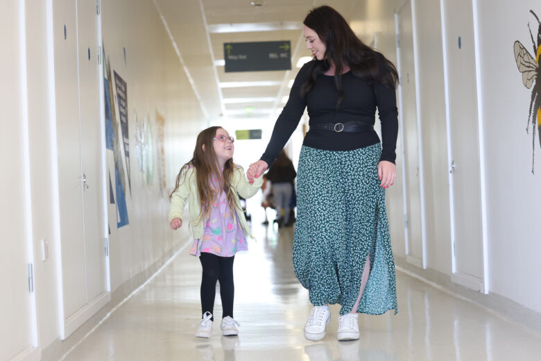 Photo of mum and child holding hands
