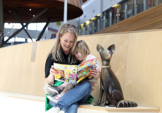Mum reading to her child