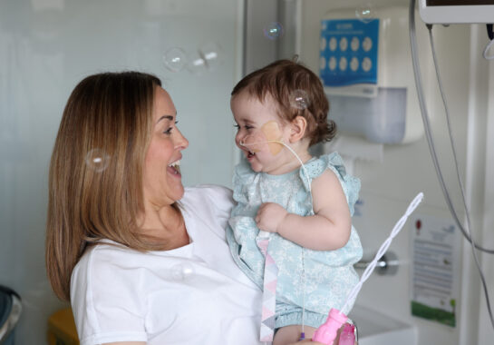 Mum and baby blowing bubbles