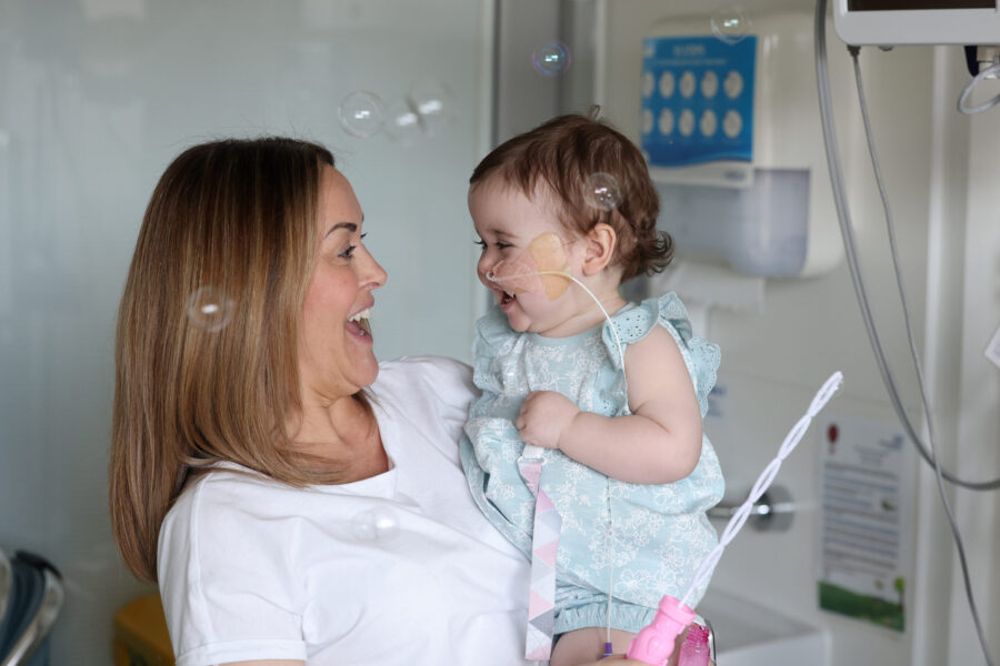 Mum and baby blowing bubbles