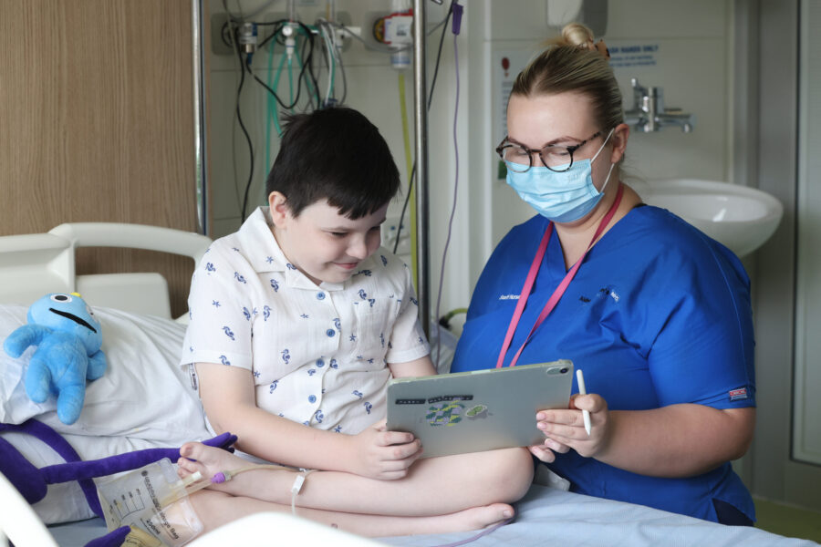 Nurse with child on ward