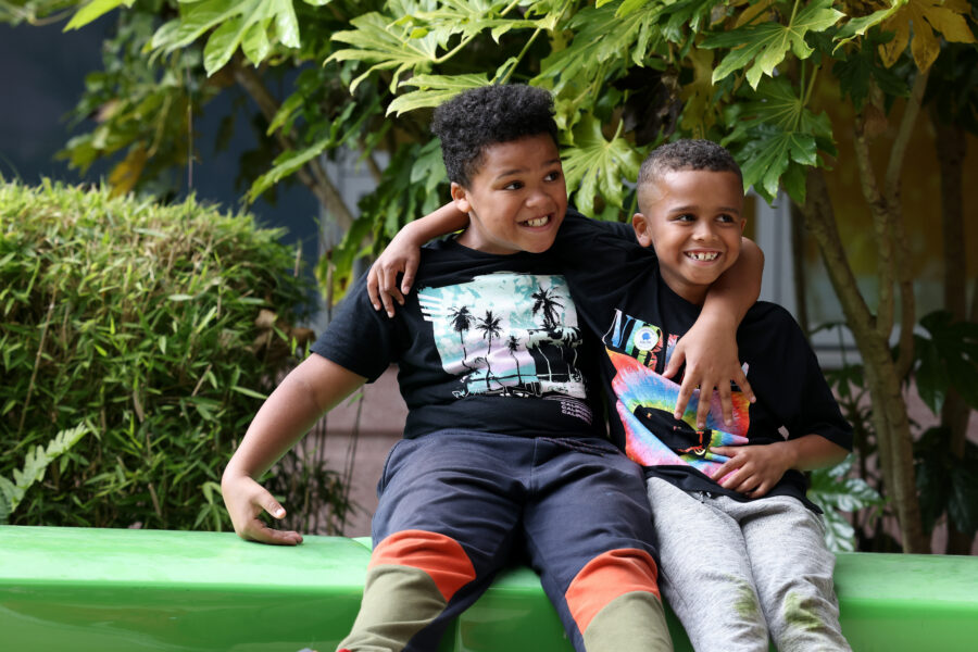 Two children with arms around each other
