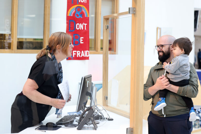Parent talking to receptionist