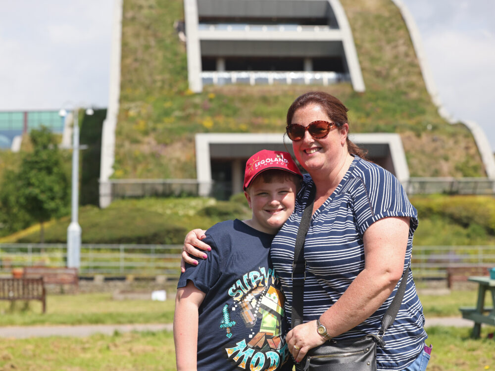 Mum and child in the park and next to the hospital