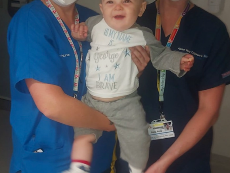 George with two nurses